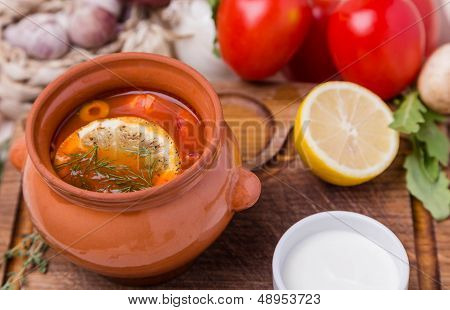 Soup Saltwort With Garnish In Brown Ceramic Pot