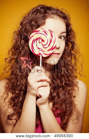 happy young woman with lollipop
