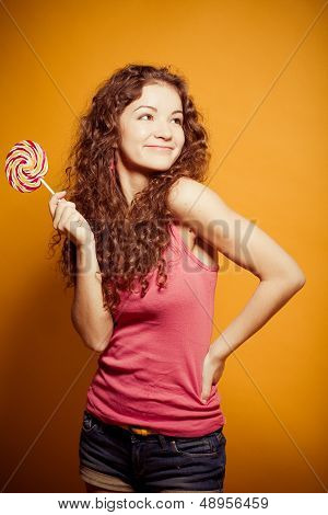 happy young woman with lollipop