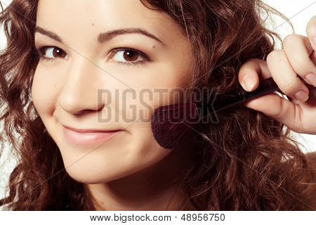 woman is making make-up