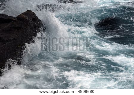 Waves Beating The Rock