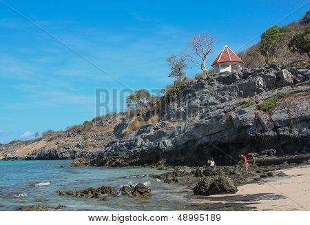 Mountains Extending From The Shore Into The Sea