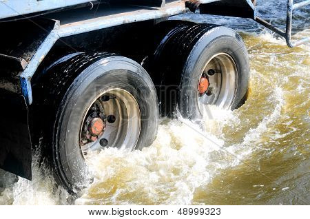 Close Up Wheel Of Tunk Drink In Flood Water