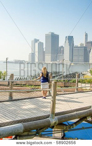 Young blond woman at Squibb Bridge near Brooklyn Promenade, NYC