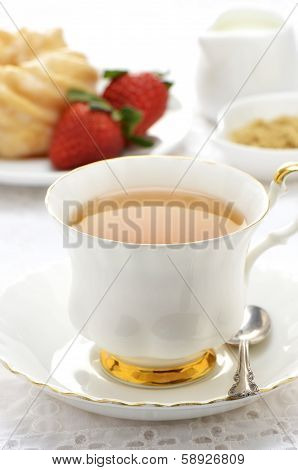 Tea  With Cruller And Strawberries