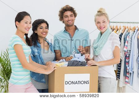 Group of young people with clothes donation