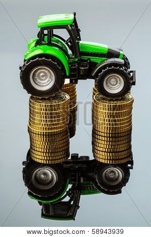 farmers in agriculture have to reckon with rising costs. higher prices for feed, fertilizer and plants. tractor with coins