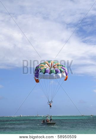 Parasailing in a blue sky in Punta Cana, Dominican Republic