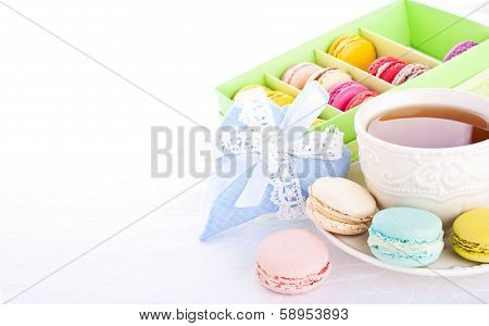 Cup Of Tea With Colorful French Macarons