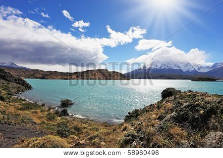 Magic turquoise lake Pehoe national park Torres del Paine, Chile. Majestic rocks Los Kuernos on the bank of the lake are covered with glaciers