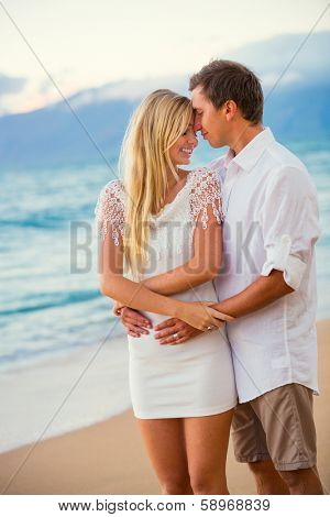 Romantic Couple Enjoying Sunset on Beautiful Tropical Beach, Love Honeymoon Concept