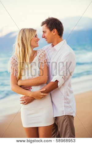 Romantic Couple Enjoying Sunset on Beautiful Tropical Beach