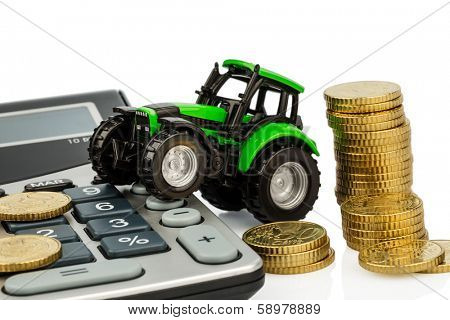 farmers in agriculture have to reckon with rising costs. higher prices for feed, fertilizer and plants. tractor with coins and calculator