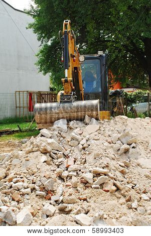 Compact Excavator On Small Building Site