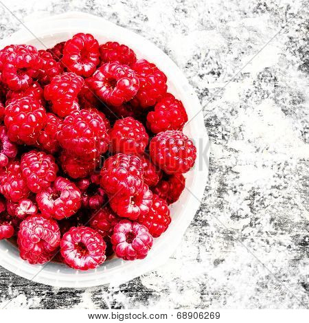 Fresh Red Raspberry In A White Bowl Over Textuted Background, Close Up. Summer Or Spring Natural Ber