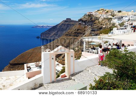 Fira, Greece - May 17: The View On Fira Town And Tourists Enjoying Their Vacation On May 17, 2014 In