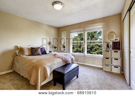 Simple Bedroom Interior With Bed And Ottoman