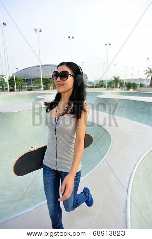 woman skateboarder at skatepark