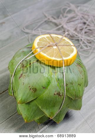 Artichoke With Vooking Twine And Lemon