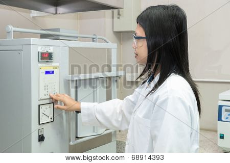 Scientists Using High Temperature Muffle Furnace In Laboratory