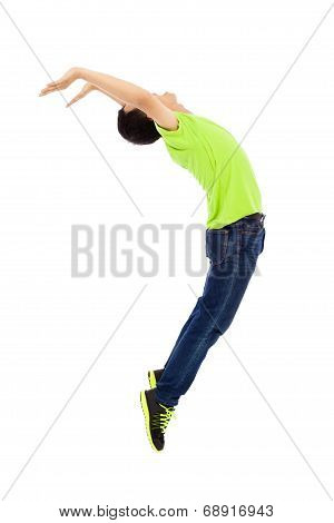 Young Man Jumping And Bending His Body