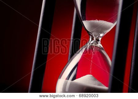 Egg Timer Or Hourglass On A Red Background