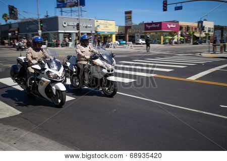 LOS ANGELES - July 23, 2014: President Barack Obama's motorcade crossing corner of 3rd Street and La Brea Avenue during presidential visit to LA.