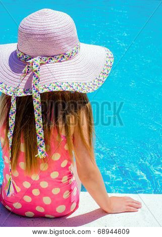 Young Girl Sat By The Pool