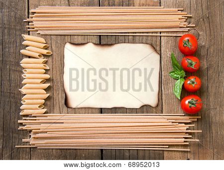 Pasta, Tomatoes And Basil On Wooden Background