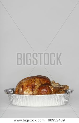 Roasted turkey in tinfoil pan