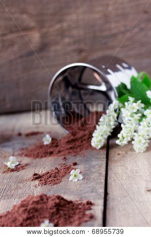 bird cherry flour with sifter on wooden table