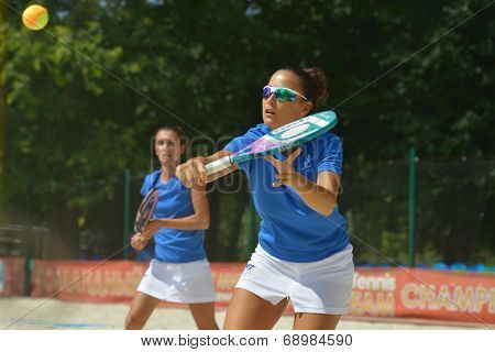 MOSCOW, RUSSIA - JULY 18, 2014: Federica Bacchetta (in front) and Sofia Cimatti of Italy in the match against France during ITF Beach Tennis World Team Championship. Italy won in two sets