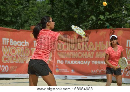 MOSCOW, RUSSIA - JULY 18, 2014: Woman double of China in the match against Greece during ITF Beach Tennis World Team Championship. Greece won in two sets