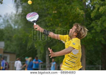 MOSCOW, RUSSIA - JULY 18, 2014: Vinicius Font of Brazil in the match against Cyprus during ITF Beach Tennis World Team Championship. Brazil won 3-0