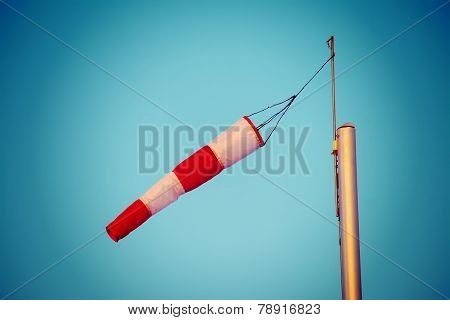 Close Up Of A Wind Sock Under A Blue Sky In Vintage Tone