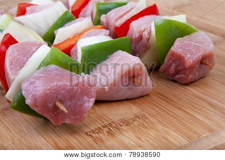 Shashlik with bacon, paprika, onion