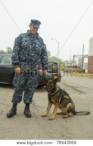Unidentified navy with K-9 dog providing security during Fleet Week