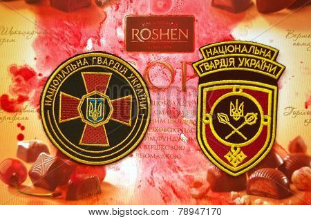Kiev,Ukraine.Dec 20.Illustrative editorial.Chevron of Ukrainian National Guard.With logo Roshen Inc. Trademark Roshen is property of ukrainian president Poroshenko.At December 20,2014 in Kiev,Ukraine 