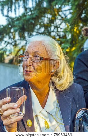 Woman Enjoys The Party And Holds A Glass Of Water In Her Hand