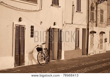 Bicycle Leaning Against The Wall In Alghero