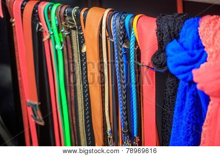 Collection of Colorful  Belts on Rack