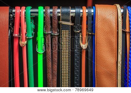 Collection of Colorful  Belts on Rack