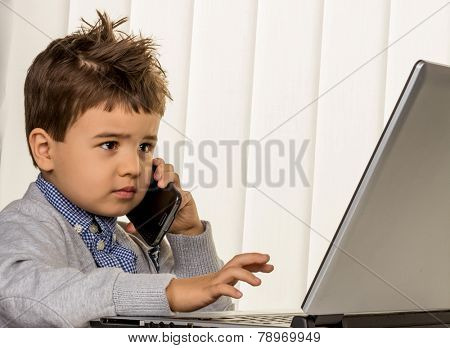 little boy on a laptop, symbol of the internet, e-commerce, consumer behavior