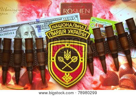 Kiev,Ukraine.Dec 20.Illustrative editorial.Chevron of Ukrainian National Guard.With logo Roshen Inc. Trademark Roshen is property of ukrainian president Poroshenko.At December 20,2014 in Kiev, Ukraine