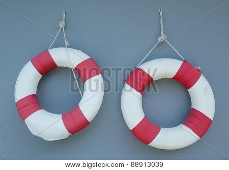 Two Life Buoy Hanging On A Wall