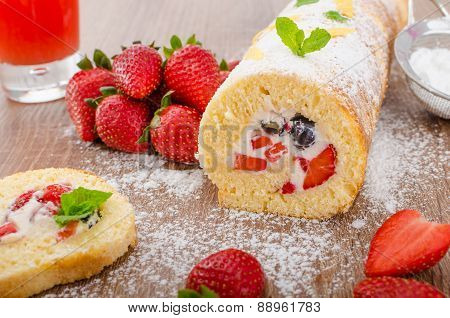 Sponge Roll With Strawberries And Blueberries