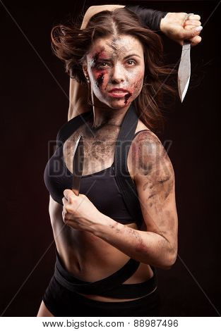 Killer woman with knife. Riot girl. Posing in studio.