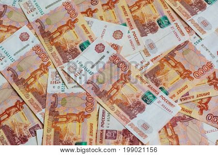 The Concept Of Planning Of Revenues And Expenses: Many Russian Five-thousandth Banknotes Laid Out On