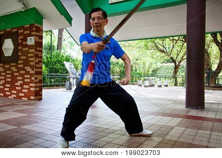 HONG KONG â JULY 12, 2017: An unidentified athlete at the Wushu School in Hong Kong