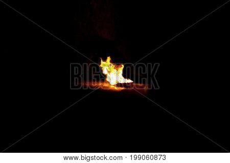 Brightly burning fire on a black background